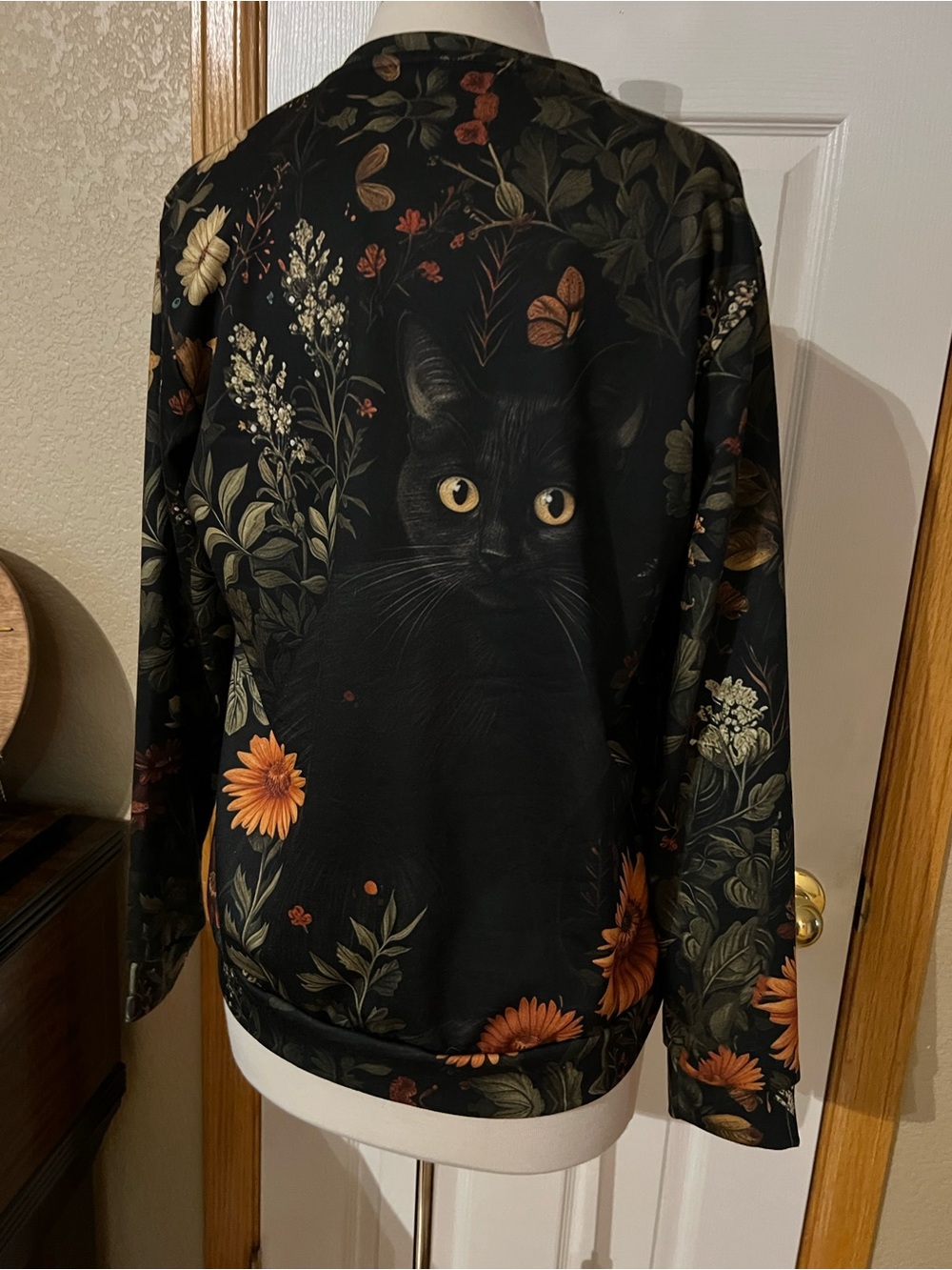Black Floral Cat-Print Pet Jacket with Orange Accents